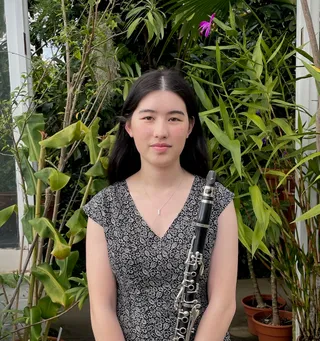 Jessica Klurfeld holding a clarinet